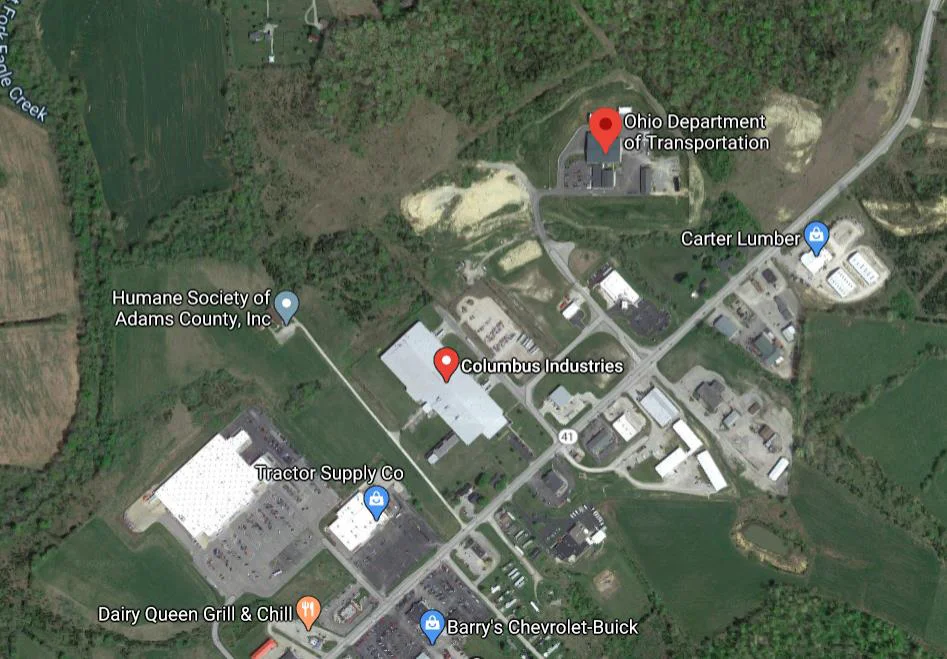 n aerial satellite map showing the Adams County Industrial Park area. Key locations labeled include Columbus Industries, Ohio Department of Transportation (ODOT), Carter Lumber, Tractor Supply Co, and the Humane Society of Adams County.